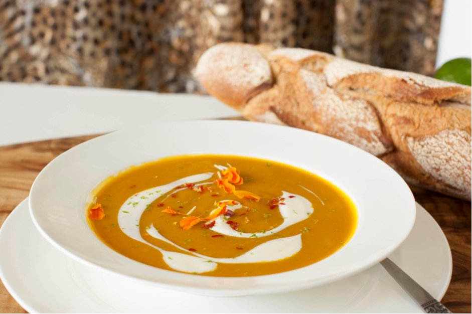 Saffron, lime and chili infused butternut broth with creamy chive and feta dollop