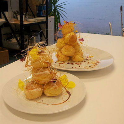 Mini croquembouche with petals, filled with Tahitian vanilla custard...