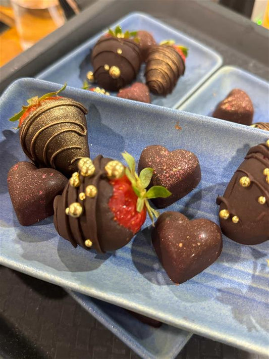 Chocolate-dipped strawberries and Italian chocolates from a Rustic Italian Cooking Class and Italian food experience.