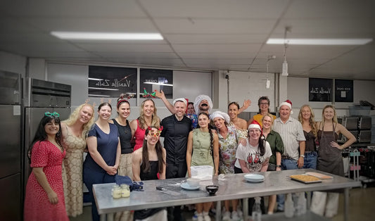 Brisbane companies are choosing cooking workshops, featuring a Brisbane corporate team in a hands-on cooking workshop