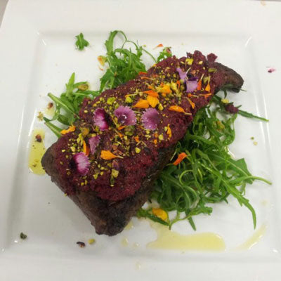 Fiery beef fillet with spiced beetroot pesto, pistachios and petals